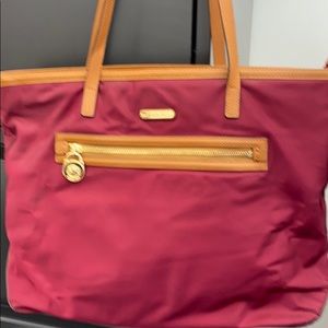 Michael Kors burgundy purse.